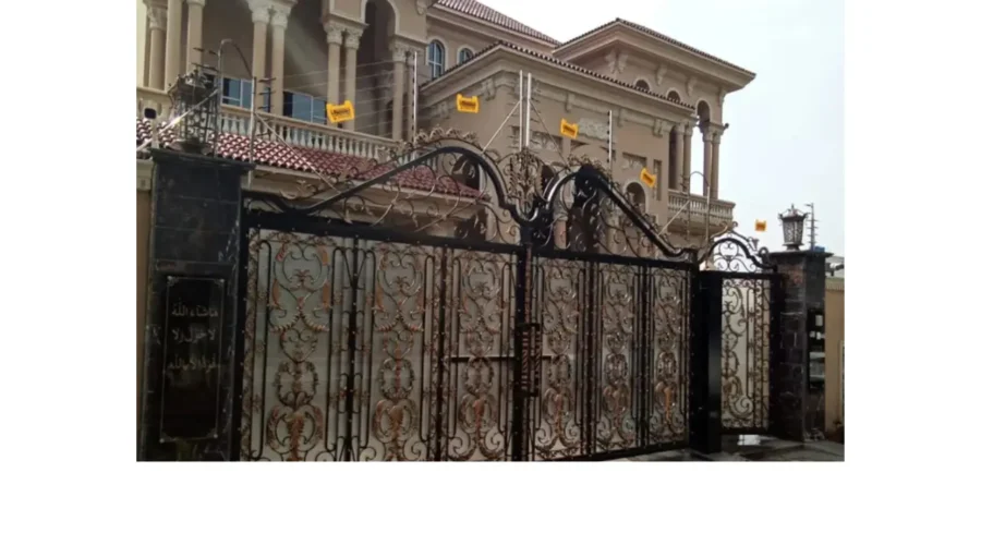 Electric fence gate installed on a farm or ranch to control livestock movement.