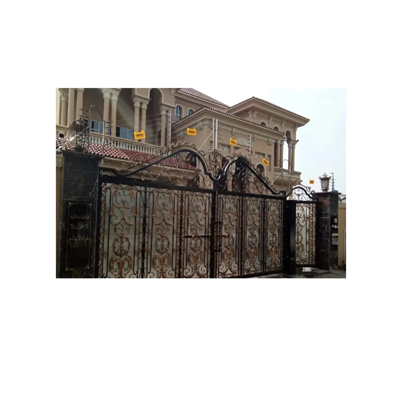 Electric fence gate installed on a farm or ranch to control livestock movement.