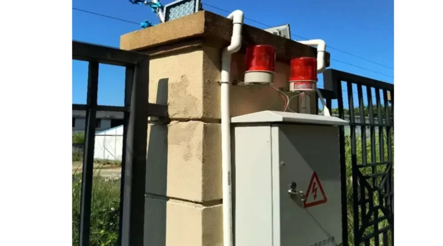 Electric fence alarm system installed on a residential property to deter intruders.