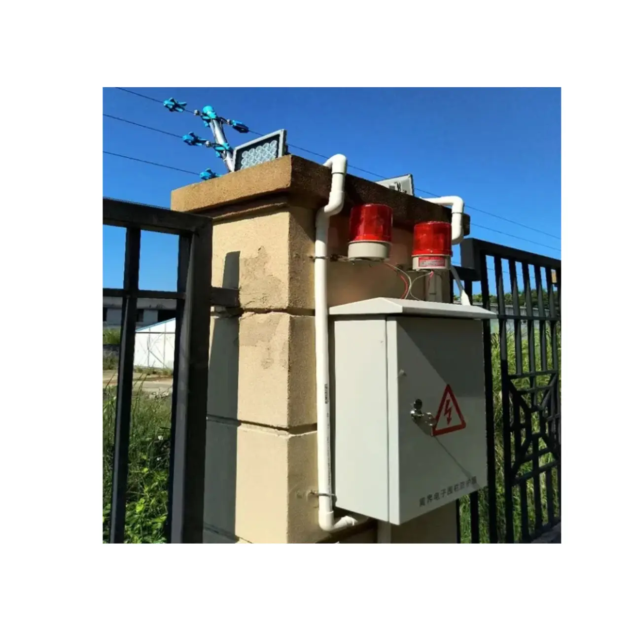 Electric fence alarm system installed on a residential property to deter intruders.